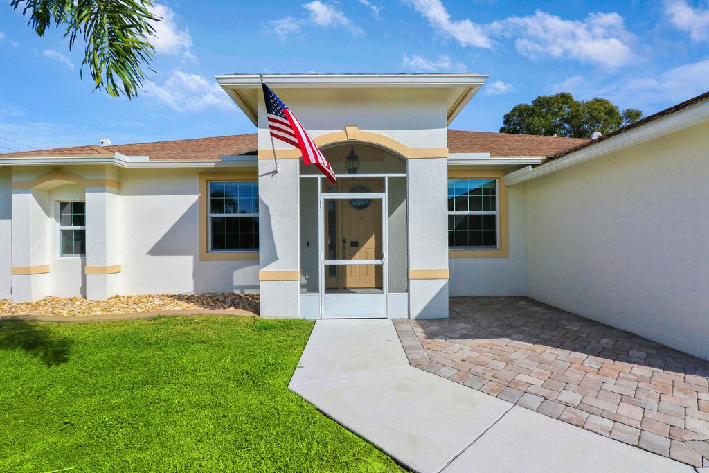 Photo of 3901 SW Laffite Street, Port Saint Lucie, FL 34953 (MLS # R10951556)