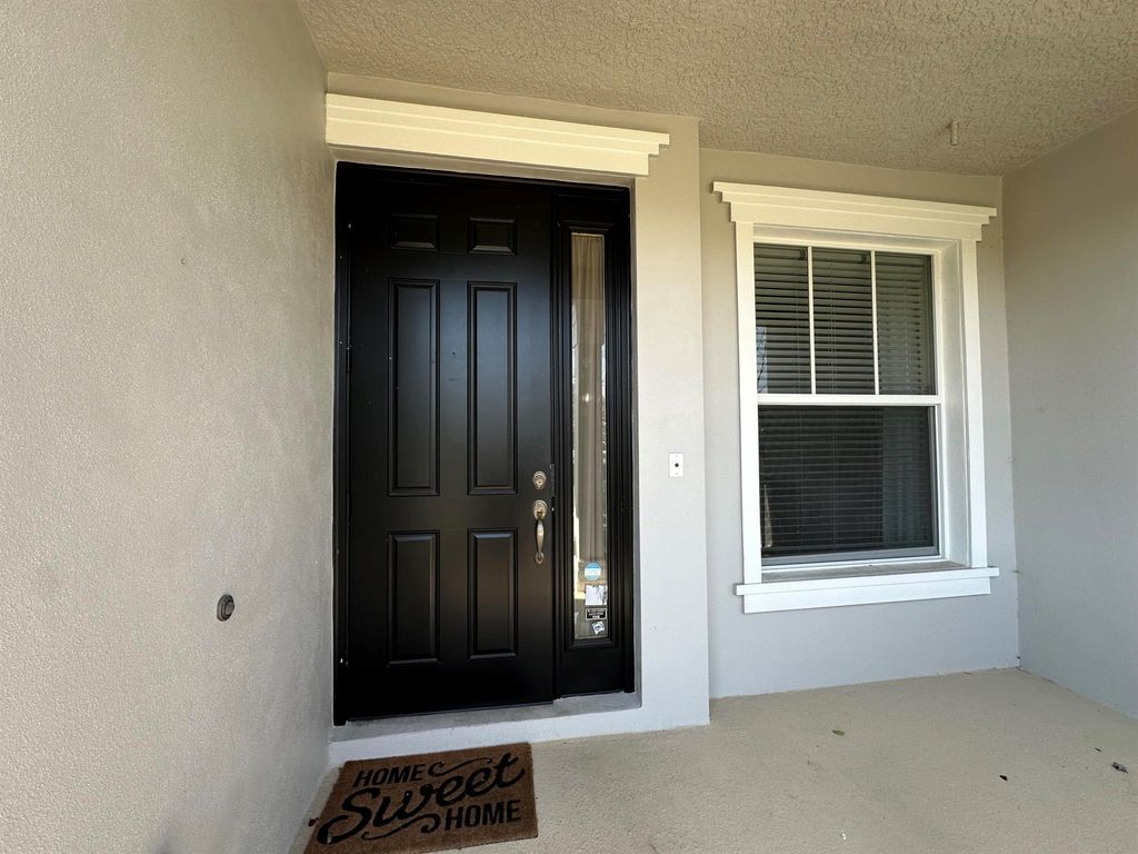 Photo of 10479 SW Westlawn Boulevard, Port Saint Lucie, FL 34987 (MLS # R11067704)