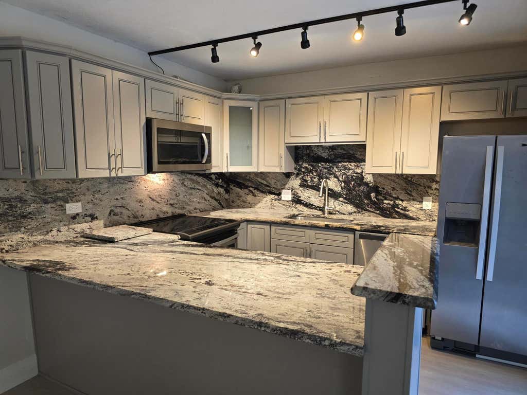 Photo of 1480 MASTERS Circle #171, Delray Beach, FL 33445 (MLS # B26061432)