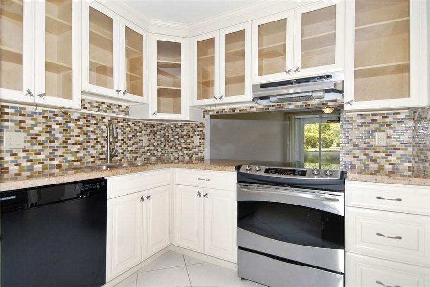 Welcome to Paradise in Palm Aire! This remarkable Condo offers serene golf course views from the first floor. Step into a home that has been thoughtfully renovated, featuring a farmhouse chique kitchen, and updated bathrooms with matching vanities for cohesive aesthetic. The unit boasts white tile flooring in the main living area and a high quality laminate flooring in the main bedroom. The Washer and Dryer are conveniently located inside the unit.Exciting new developments are being built across the street from Powerline Road, offering a variety of entertainment, shopping and dining close by in the near future. Palm Aire is known for its many walk and jogging paths through beautiful and luscious landscaping allowing residents to embrace the Florida lifestyle to the fullest.