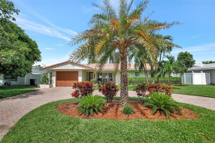 This meticulously maintained home is located in the gated, beachside community of Bel Air. The house features numerous updates, including a brand-new, beautiful kitchen with an extended island. You will enjoy the porcelain tile floors throughout the home, a practical interior laundry room, impact windows and doors for added safety, as well as a single-car garage. You will experience Florida living at its best with the spacious 24 x 10 screened room that extends the living space. The paver circular driveway adds curb appeal and provides plenty of parking spaces. There's room in the backyard for your personal touch, such as a garden or a pool. Pompano Beach offers a comfortable, coastal lifestyle. Make this house your home today.