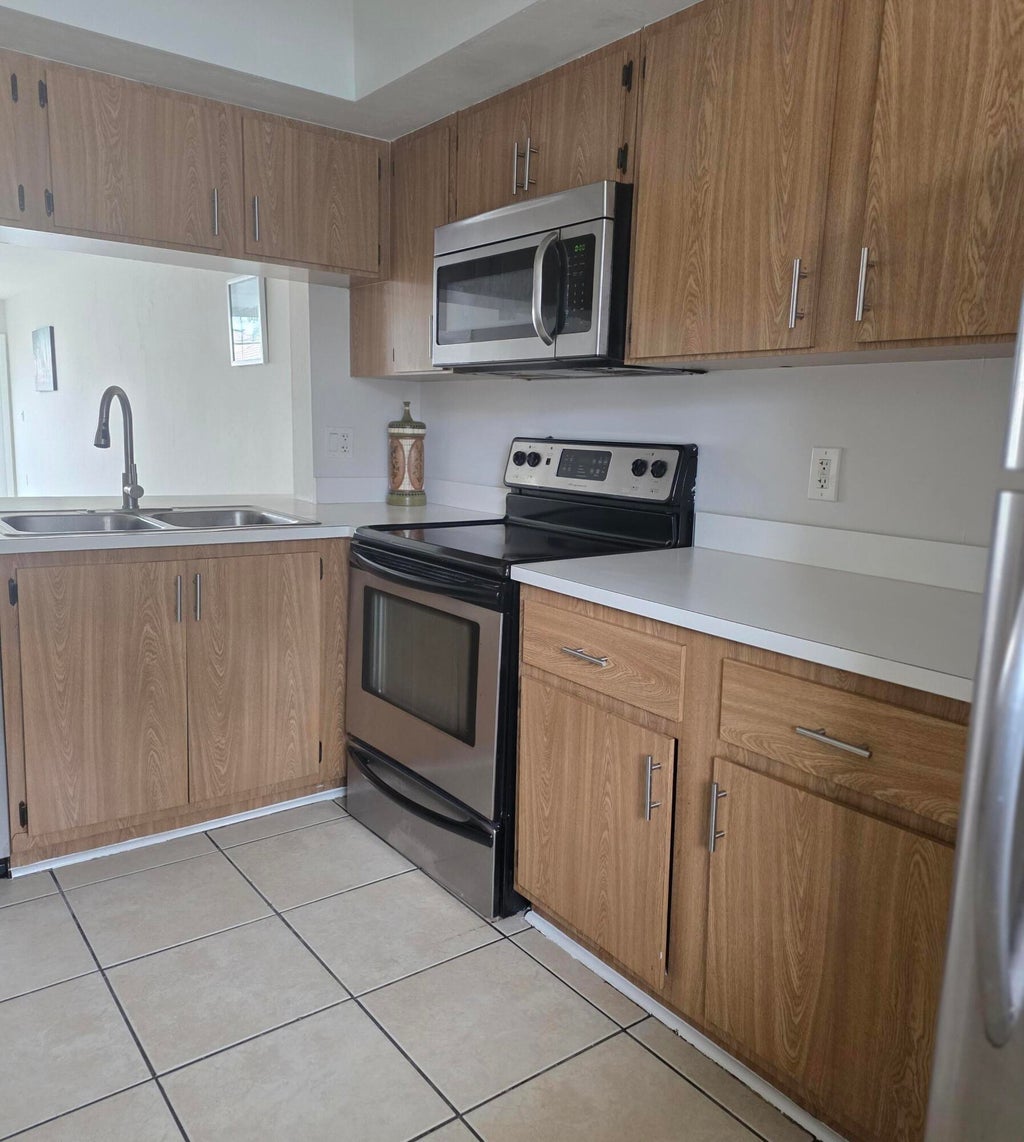 Photo of 1503 Palm Beach Trace Drive, Royal Palm Beach, FL 33411 (MLS # B26045610)