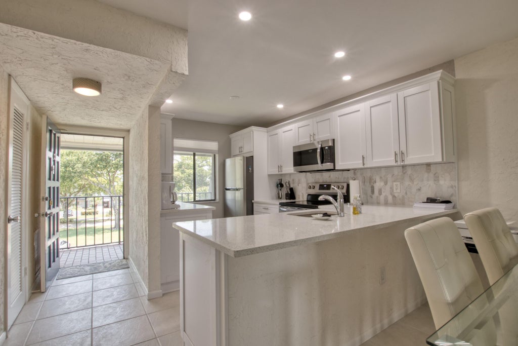 Photo of 4801 Esedra Court #307, Lake Worth, FL 33467 (MLS # R10982623)