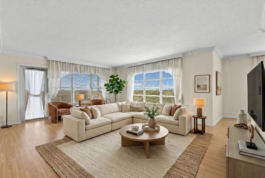 Your next home is here—a spacious corner 2/2 with beautiful natural light, crown molding, and a balcony perfect for sunrise coffee. The master has a large walk-in closet, and the 2nd bedroom comes with a Murphy bed for extra flexibility. Located in a secure 55+ Coral Springs community with 24/7 security, pool, gym, library, laundry on every floor & more. Water, cable & internet included!