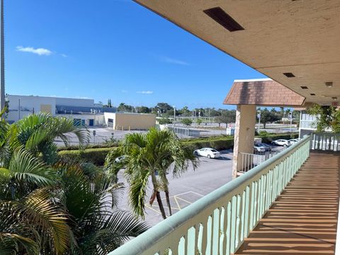 Photo of 400 Village Green Circle W #304, Palm Springs, FL 33461 (MLS # R11155866)