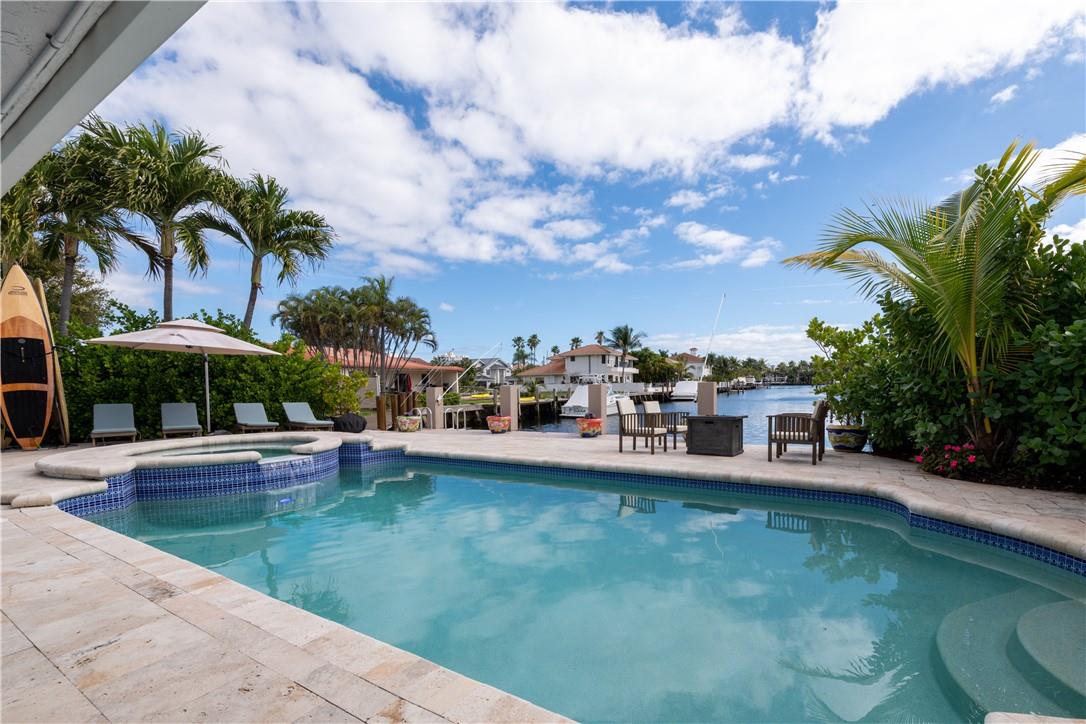 ENYOY THIS FANTASTIC HOME LOCATED IN TROPIC ISLE, A LUXURIOUS WATERFRONT COMMUNITY. IT HAS AN AMAZING BACKYARD AND WATERFRONT AREA WITH 50 FEET ON THE INTRACOASTAL WATERWAY AND A PRIVATE DOCK. 2 FIRE PITS, HOT TUB, MULTIPLE SEATING AREAS AND OUTSIDE SCREENED SHOWER. PROPERTY RENOVATED AND NEW FURNISHINGS IN 2024. OPEN KITCHEN DESIGN. MARBLE MASTER BATHROOM WITH 4 PERSON STEAMROOM. POOL, LAWN AND MAID SERVICE INCLUDED.