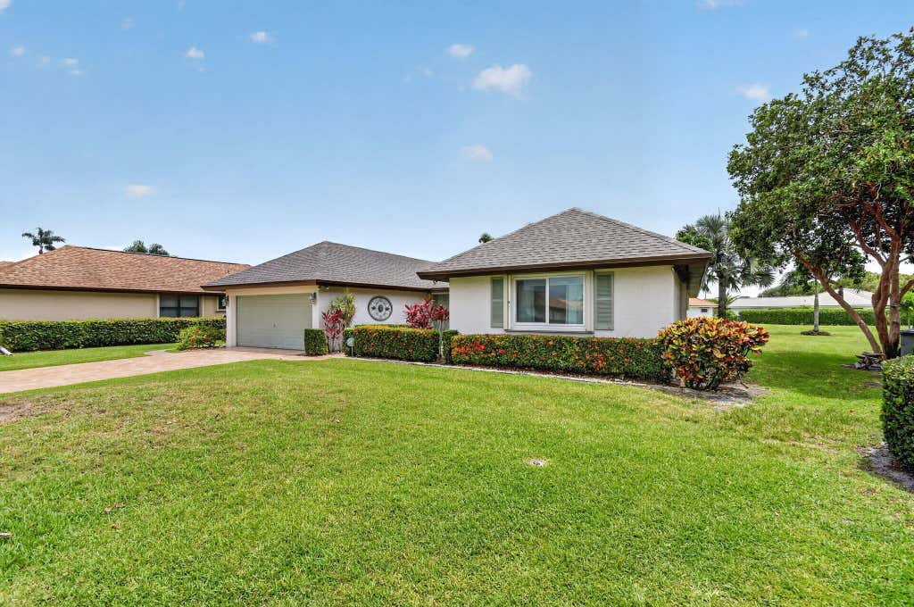 Photo of 10460 Greentrail Drive N, Boynton Beach, FL 33436 (MLS # B26035641)