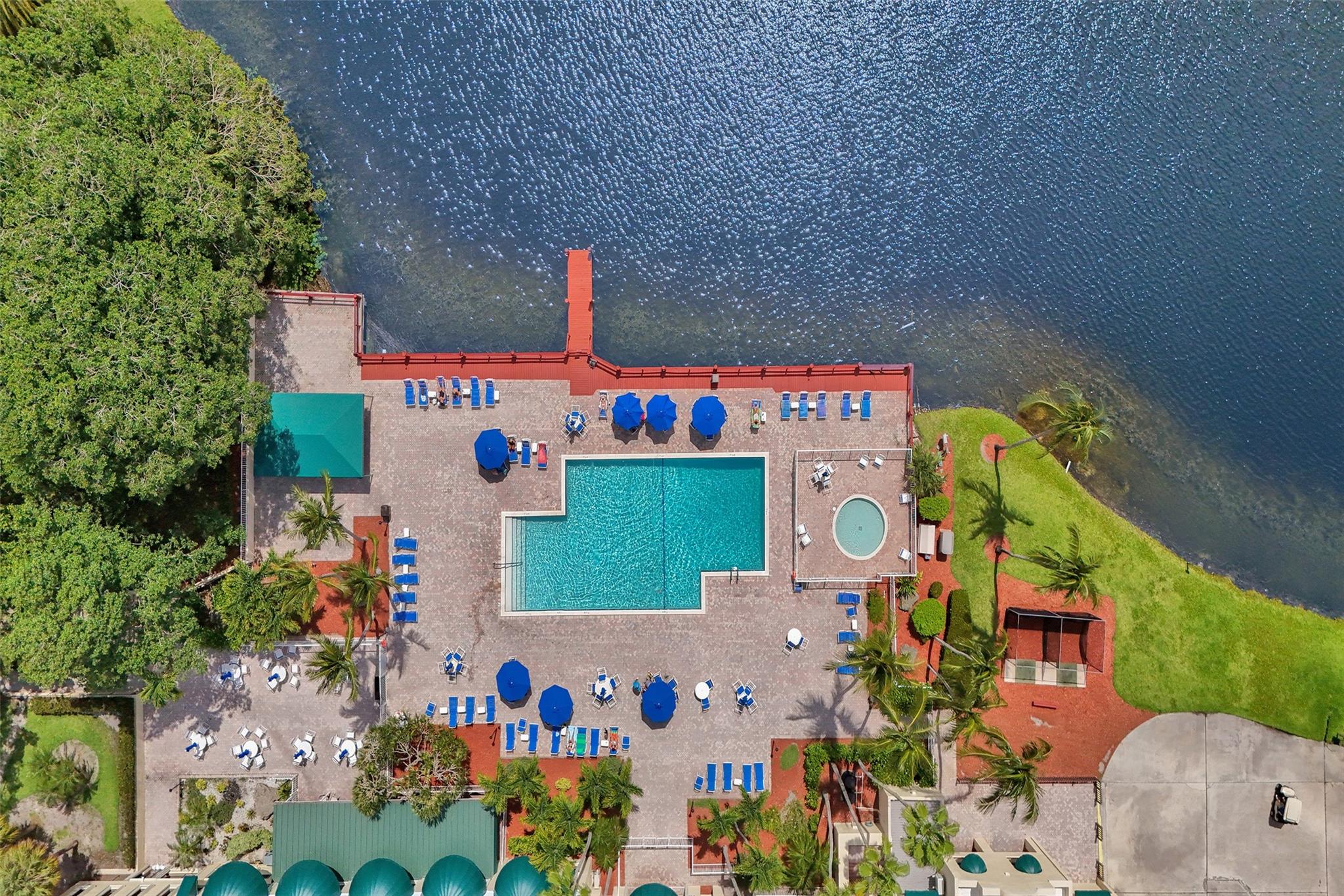 Beautiful lake view 2BR/2BA condo in Pine Island Ridge! Spacious, clean, and well-maintained 2nd-floor unit with open living area, 2023 Instahot tankless water heater, 2022 A/C, and stainless steel appliances. Enjoy generous natural light from large impact windows throughout. Steps from the pool with nearby storage. Large primary bedroom with walk-in closet and private bath. Includes country club membership, 18-hole golf course, clubhouse pool, fitness center, tennis, basketball, bocce ball, playground, private dining, and more. Perfect for full-time living or a peaceful vacation home. Close to top-rated schools, shopping, major colleges, and FLL airport. A must-see!