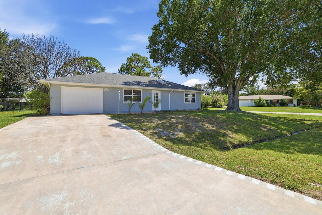Photo of 580 SW Duval Avenue, Port Saint Lucie, FL 34983 (MLS # B26042827)