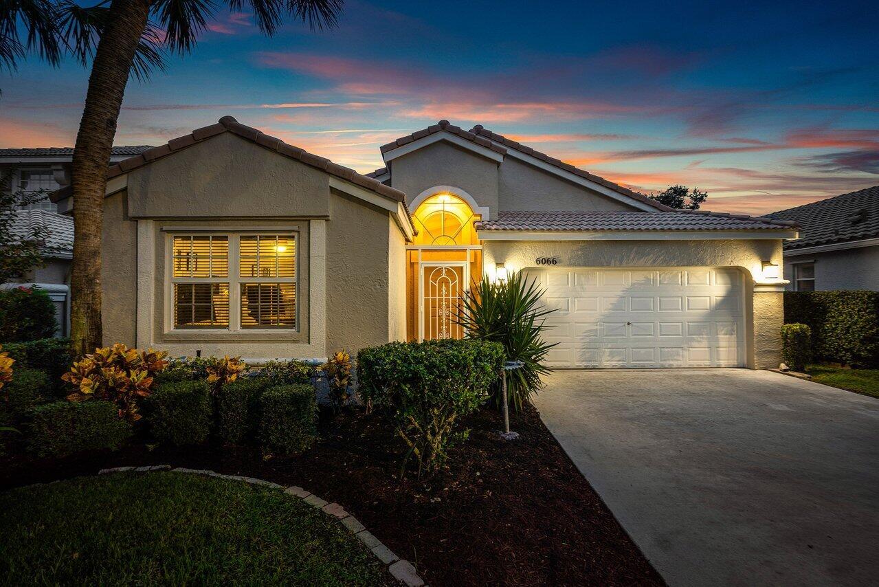 Beautiful One-Story Home in the Highly Desirable Gated Community of Smith Farm! Welcome to this impeccably maintained, single-owner residence located in the private, family-friendly neighborhood of Smith Farm in LAKE WORTH . Nestled within a 24-hour manned and gated community, this one-story home offers a perfect blend of comfort, style, and convenience.The thoughtfully designed open-concept floor plan is ideal for both everyday living and entertaining. The spacious family and living rooms flow effortlessly together, enhanced by vaulted ceilings, arched architectural details, and an abundance of natural light pouring in through large windows and sliding glass doors. The oversized master suite features ample room for a sitting area or home office, and the screened-in patio with upgraded