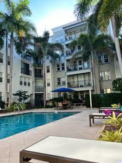 BEST LOCATION IN THE BUILDING! Welcome to spacious 2/2 split floor plan with the largest balcony overlooking serene pool area. This unit has been updated with new flooring, baseboards, fresh paint and SS appliances. The master bedroom has large walk-in closet and the master bathroom has separate shower & tub. Washer & dryer are conveniently in your unit. The building offers covered parking in secure garage with 1 assigned space. You can add second space for additional fee. Sole offers first rated amenities including a pool, whirlpool, Zen Garden, fitness center, sundeck with amazing views and grilling/dining/sunning. The HOA includes high speed internet and basic cable. Tenants are responsible only for FPL. Flagler Village is the highly desirable ''place to be'' in, minutes from Las Olas.