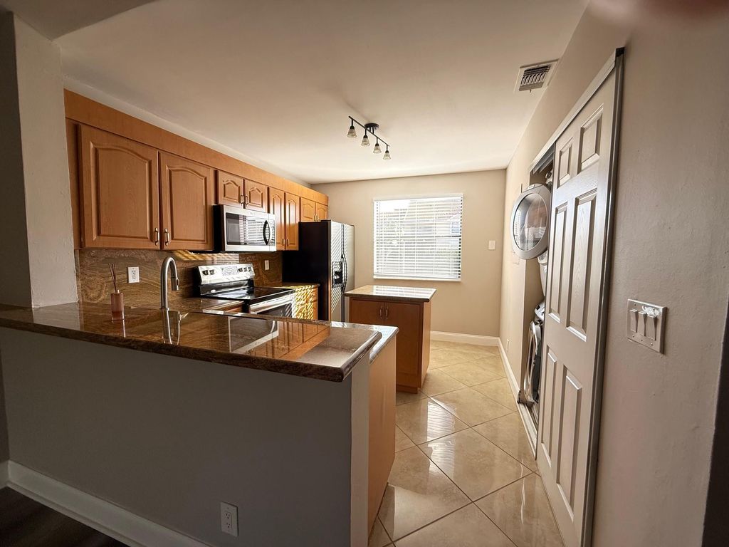 Photo of 5781 Riverside Drive #201, Coral Springs, FL 33067 (MLS # F10538743)