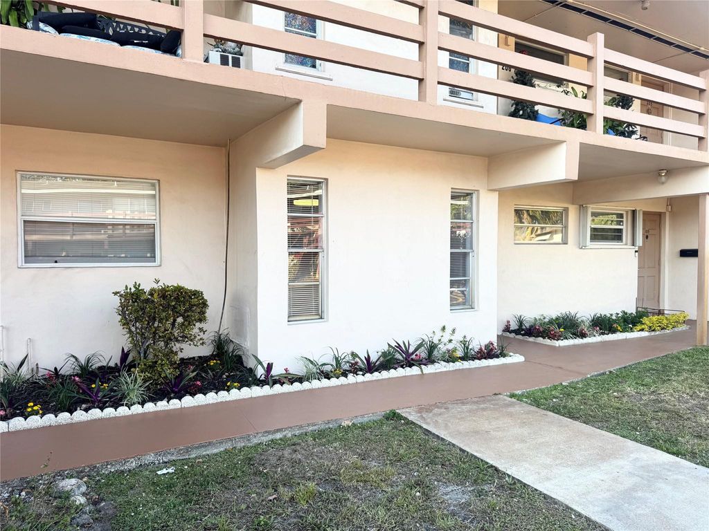 Photo of 3000 NW 43rd Terrace #106, Lauderdale Lakes, FL 33313 (MLS # F10554196)