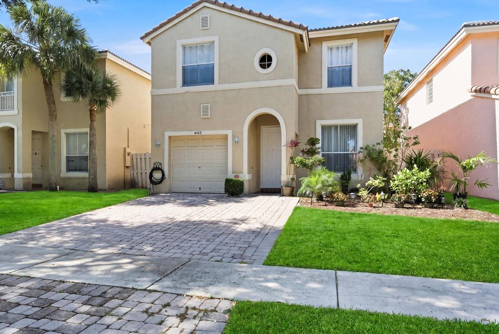 Photo of 4162 Winnipeg Way, West Palm Beach, FL 33409 (MLS # B26020763)