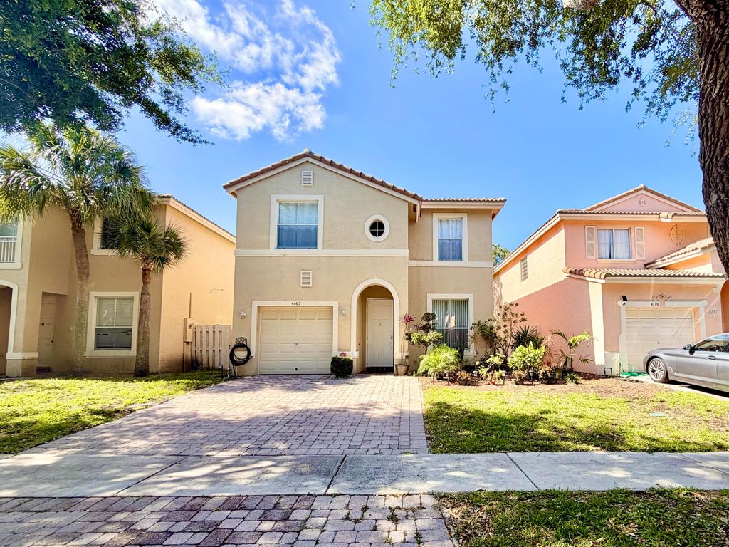 Photo of 4162 Winnipeg Way, West Palm Beach, FL 33409 (MLS # B26020763)