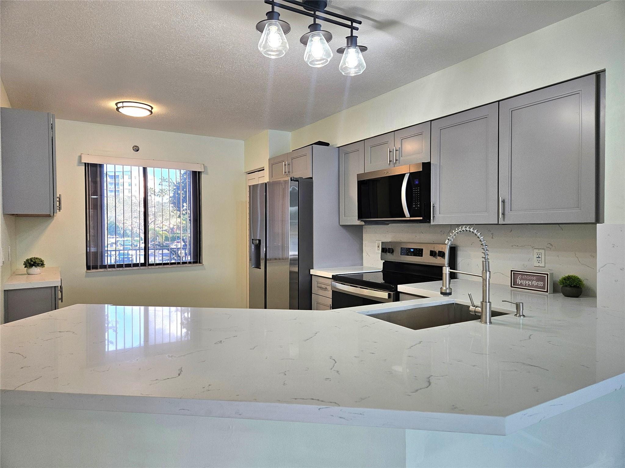 JUST REMODELED * CORNER UNIT * WATER VIEW * 2 BED, 2 FULL BATHS * FULL SIZE WASHER & DRYER * HURRICANE SHUTTERS * BRAND NEW KITCHEN * BRAND NEW STAINLESS STEEL REFRIGERATOR * BRAND NEW ELECTRIC RANGE * BRAND NEW MICROWAVE * BRAND NEW CABINETS * BRAND NEW COUNTERTOPS * BRAND NEW FLOORS * BRAND NEW CEILING FANS * BRAND NEW BLINDS * BRAND NEW VERTICALS * NEW BATHROOM VANITIES * NEW FAUCETS & SINKS * DUAL SINKS & WALK-IN SHOWER IN PRIMARY BATHROOM * LARGE WALK-IN CLOSET IN PRIMARY BEDROOM * BATHTUB | SHOWER IN GUEST BATHROOM * LARGE PRIVATE SCREENED IN BALCONY WITH LAKE VIEW * STORAGE ROOM RIGHT NEXT YOUR FRONT DOOR * CLOSE TO SHOPPING, GROCERY, POST OFFICE, I-95 & CASINO * BE THE FIRST TO ENJOY THIS BEAUTIFULLY RENOVATED CONDO LOCATED IN THE HIGHLY SOUGHT-AFTER COMMUNITY OF CYPRESS BEND!!!