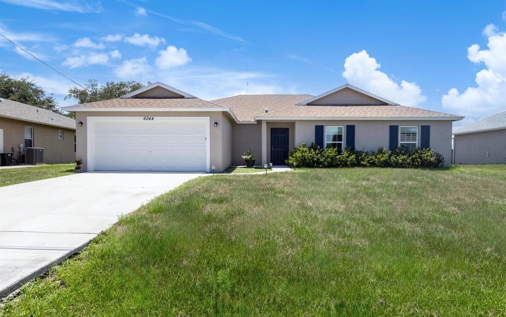 Photo of 6044 NW Wolverine Rd, Port St Lucie, FL 34986 (MLS # R10998615)