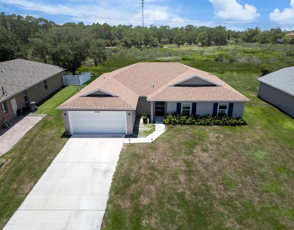 Photo of 6044 NW Wolverine Rd, Port Saint Lucie, FL 34986 (MLS # R10998615)