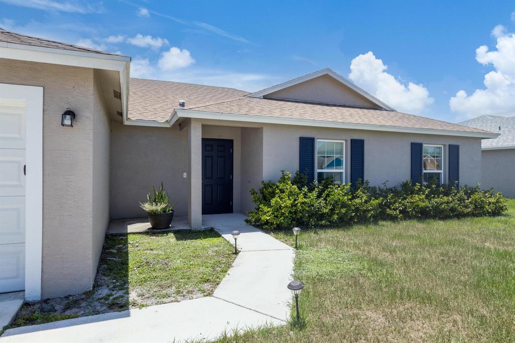 Photo of 6044 NW Wolverine Rd, Port Saint Lucie, FL 34986 (MLS # R10998615)