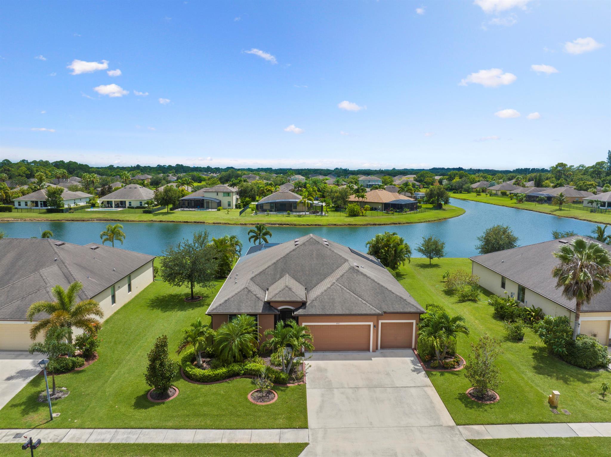 This stunning 3-bedroom, 3-bath Redbud model with a 3-car garage in Ashley Lakes North combines comfort, style, and peace of mind. The open-concept design features tile flooring throughout and seamlessly connects to the outdoor living space, where a sparkling saltwater pool with solar heating invites relaxation against tranquil lake views. For added security and convenience, the home is equipped with storm-ready accordion shutters and a whole-house Generac generator. A spacious 3-car garage provides ample storage, while the low HOA fee makes ownership especially attractive. With its thoughtful upgrades and serene setting, this home offers the perfect balance of everyday practicality and modern Florida living.