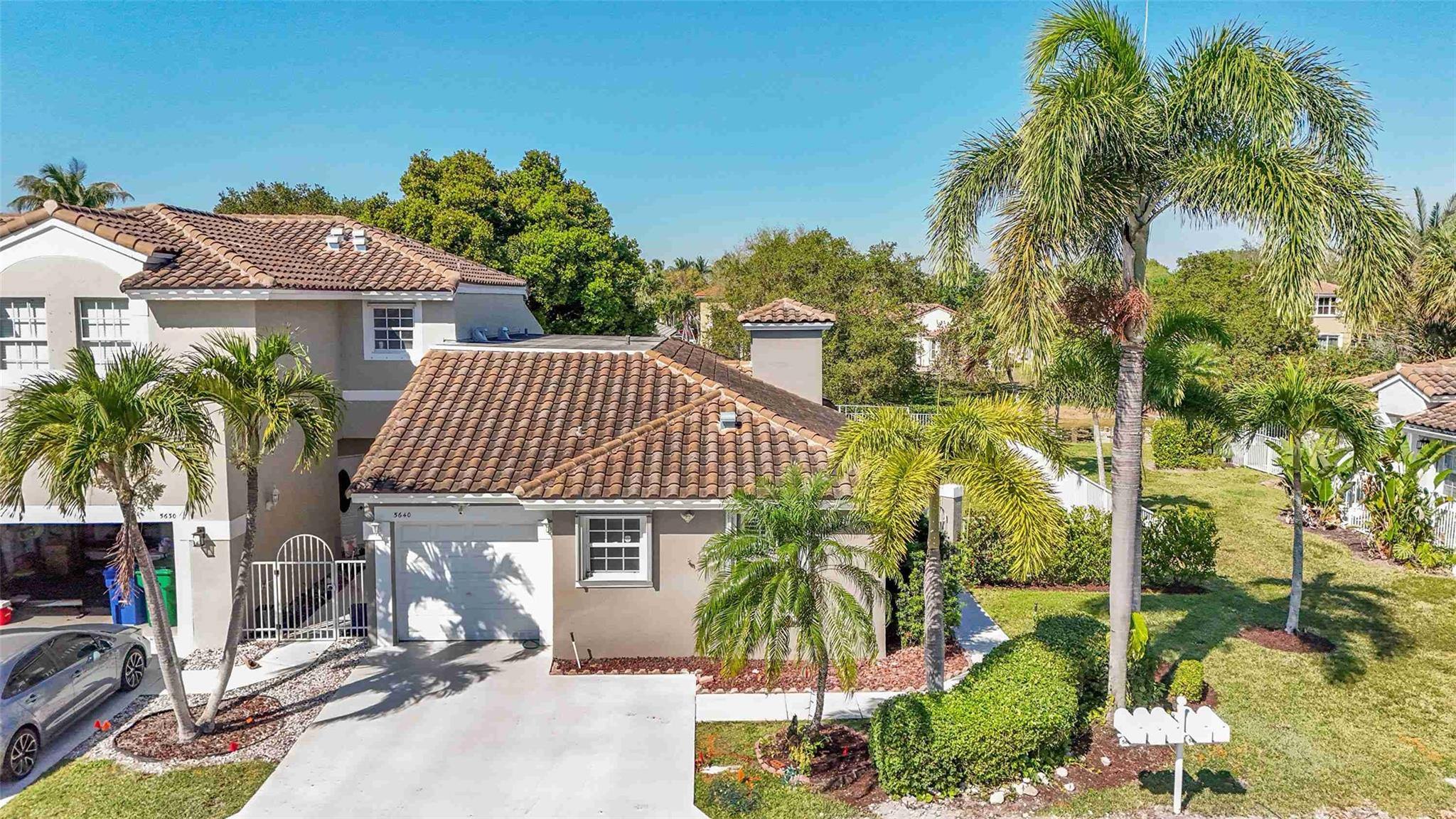 Magnificent Villa Sits on an Oversized, Fenced-In Lot with Beautiful Water View. Updated 3 Bedroom, 2 Bath End Unit in Gated Addison Court at Wyndham Lakes. Large Updated Kitchen with Granite Counters, Newer Appliances and Updated Bathrooms. Updated Flooring Throughout. Spacious Living Room and Dining Room. French Doors Open to the Large Covered and Screened-In Patio. Fully Fenced and Spacious Yard. Hurricane Impact Front Door and Complete Accordion Shutters. Community Pool, Newer Roof - 2020, Exterior Paint 2021, A/C & Tankless Water Heater. Great Schools, Walking Distance to Top Rated Elementary School. Low HOA Covers Exterior, Roof and Lawn Service, Close to Fabulous Shopping, Terrific Restaurants and Sawgrass Expwy.