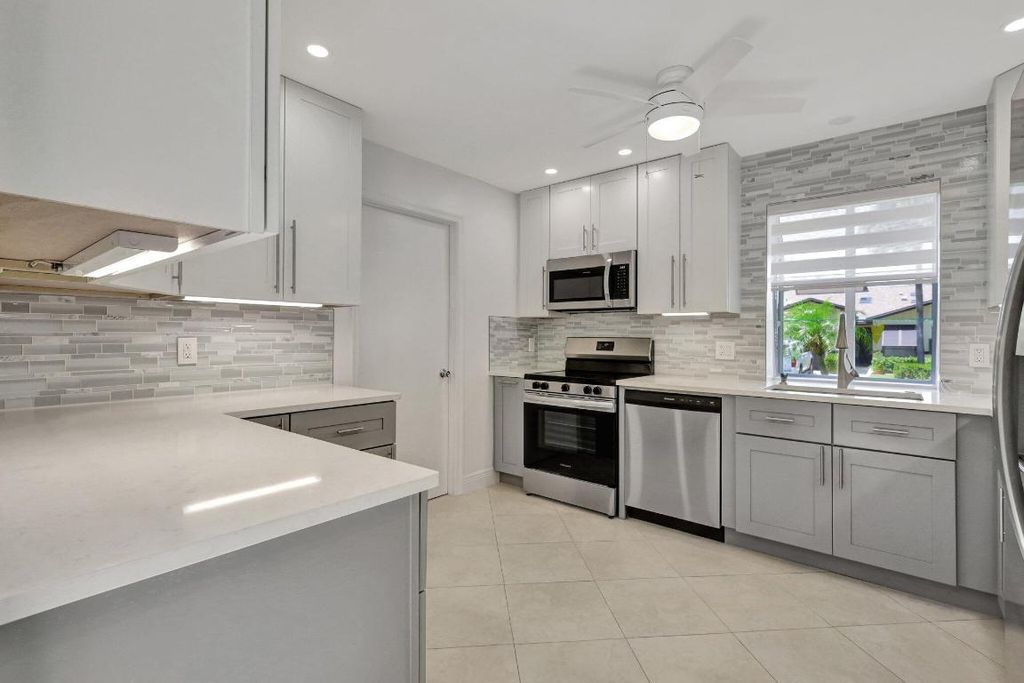 Photo of 17 Ridge Pointe Drive #A, Boynton Beach, FL 33435 (MLS # R10991129)