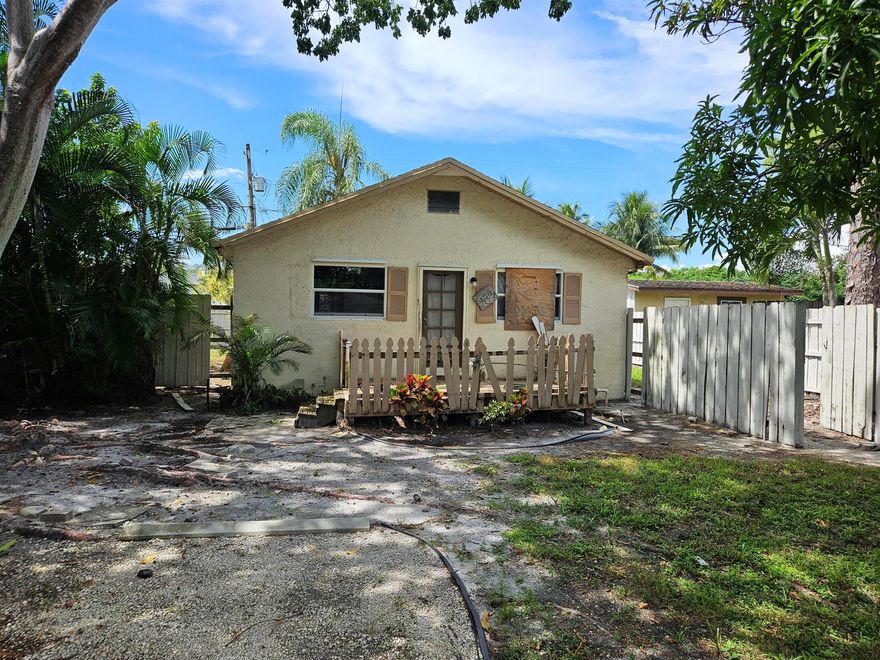 Charming Key West-style home in a great Greenacres location! Situated near both the elementary and high school, and just down the street from the Greenacres Community Center. This property offers a deep front yard with mature, fruit-bearing trees and endless potential. The home needs renovation--perfect for investors or buyers looking to remodel and create value in a growing community.