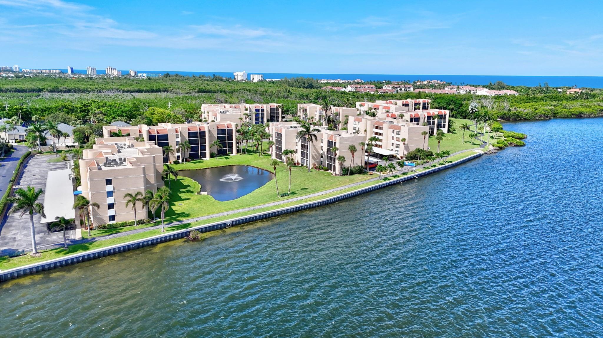 Waterfront community on Hutchinson Island causeway. Everyone loves living at Fairwinds Cove! Rare 1st floor garden condo on pool. This condo boasts 2 bedrooms & 2 baths with upgraded kitchen, Granite counters and glass backsplash, 2 walk in closets, large screened in patio and owners storage closet. Tile throughout and washer/dryer in condo. Covered carport space and ample guest parking. 2 pools, tennis & Pickleball, clubhouse with fitness room and entertaining space. Only 1/2 mile walk to beach or 2 minute drive. Fishing off sea wall! This community is gated and has low HOA fees which include building insurance, cable, wifi, all grounds, building and pools maintenance, trash and sewer, and reserves.