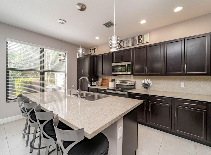 Charming gated community. Beautifully maintained 3-bedroom, 2.5-bath townhome with a 1-car garage is move-in ready, first level features an open-concept with tile flooring and carpet upstairs. Modern kitchen with stainless steel appliances, sleek cabinetry, granite countertops, and a spacious center island with seating. Spacious primary suite with a walk-in closet, bathrooms with dual vanities, tub, and a separate glass-enclosed shower. A full-sized washer and dryer are included for added convenience.Community amenities include a pool, fitness center, tot lot, and basketball courts. Conveniently located near A-rated schools, shopping, dining, and major highways, everything you need is just minutes away.Available as of April 1st. Available for showings. Call listing agent.