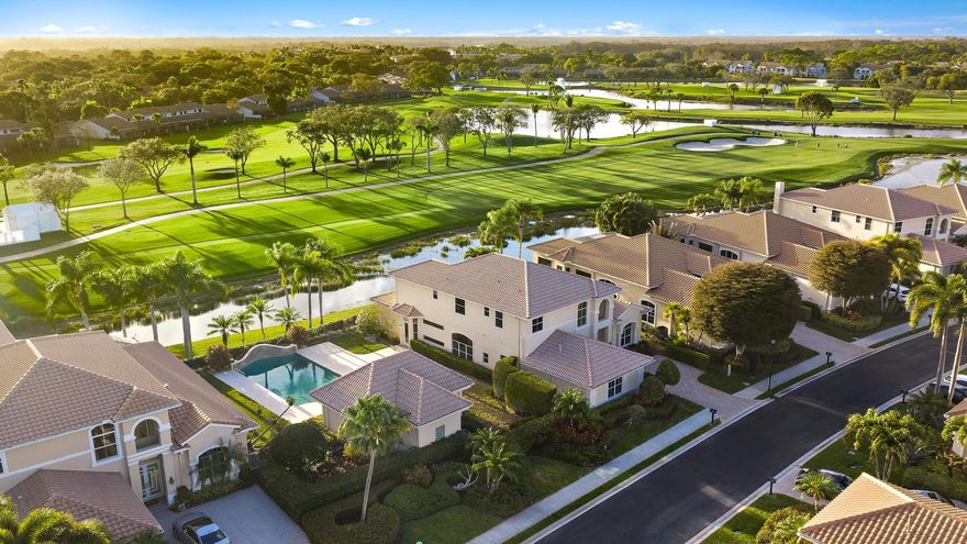 Welcome to one of the most exclusive opportunities in all of PGA National -- the only double lot available in the prestigious, double-gated community of Grand Cay. Situated on an oversized .33-acre homesite with sweeping golf and sunset views, this exceptional estate offers over 4,423 square feet of living space in the main residence, plus a private 570-square-foot guest house, making it one of the most unique properties within a community of more than 4,500 homes.

From the moment you enter, you are greeted by soaring 20+ foot ceilings, striking architectural detail, and a grand sense of scale. The main home features four bedrooms, four full bathrooms, one half bath, a dedicated office, and a spacious media room or den, offering flexibility for both everyday living and entertaining. The detached guest house includes a bedroom, full bathroom, kitchenette, and living area--perfect for extended family, guests, live-in support, or a private retreat.

Positioned along the Nicklaus-designed 16th hole of the iconic Bear Trap, the home captures spectacular west-facing sunset views from the second-floor balcony. Whether enjoying a peaceful afternoon watching golfers pass through or experiencing the excitement of the Cognizant Classic from your own backyard vantage point, the setting is truly unmatched.

Grand Cay is an intimate enclave of just 42 estate homes, offering lake and championship golf course views, a private community pool, fitness clubhouse, and 24-hour manned security behind double gates. Residents enjoy privacy and prestige within one of Palm Beach Gardens' most desirable addresses.

Living in PGA National means embracing the ultimate South Florida lifestyle. The community offers five championship golf courses, world-class tennis and pickleball, a luxury spa, resort-style pools, and seven on-site restaurants including the renowned Butcher's Club. Membership is optional, providing flexibility to enjoy the resort amenities at your discretion. Ideally located just minutes from luxury shopping at The Gardens Mall, top-rated dining, beautiful beaches, boating, Downtown West Palm Beach, Palm Beach Island, and Palm Beach International Airport, this home also sits near some of the area's most respected private schools including The Benjamin School, Oxbridge Academy, The King's Academy, and Rosarian Academy.

This is more than a home -- it is a rare opportunity to own one of the most distinctive and private properties in PGA National, offering space, views, security, and the very best of the Florida lifestyle.