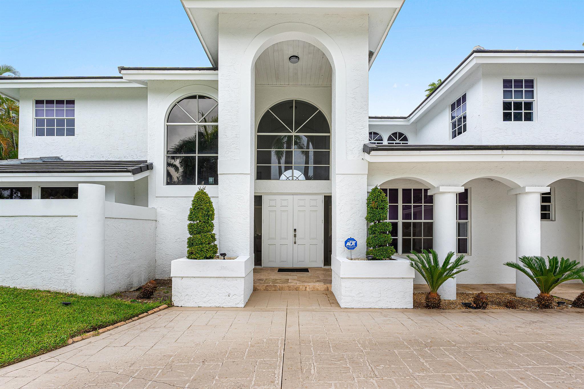 This 5BR/4BA 4,000 sq. ft. corner-lot home offers dual master suites (1 up, 1 down) and major upgrades: brand-new metal roof, new A/C units (both floors), fully renovated master & en-suite baths, custom kitchen with quartz countertops, recessed lighting, tile and marble flooring throughout, and fresh white paint. Outside, enjoy a backyard oasis with pool, motorized lanai screens, huge upstairs terrace, new garage door, white privacy fence, lush landscaping, upgraded irrigation, and all-new exterior paint lighting for stunning curb appeal day & night. Zoned for A-rated Calusa Elementary & Spanish River High--two of Boca's best schools. Truly move-in ready with all big-ticket upgrades completed. Experience country club living with ZERO INITIATION COST --SELLER COVERS THE $125,000 fee for you