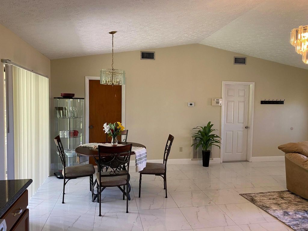 Photo of 2102 SW Burman Lane, Port Saint Lucie, FL 34984 (MLS # R11002603)