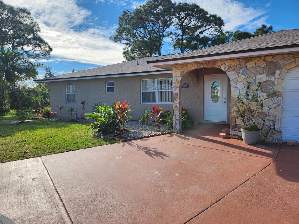 Photo of 2102 SW Burman Lane, Port Saint Lucie, FL 34984 (MLS # R11002603)