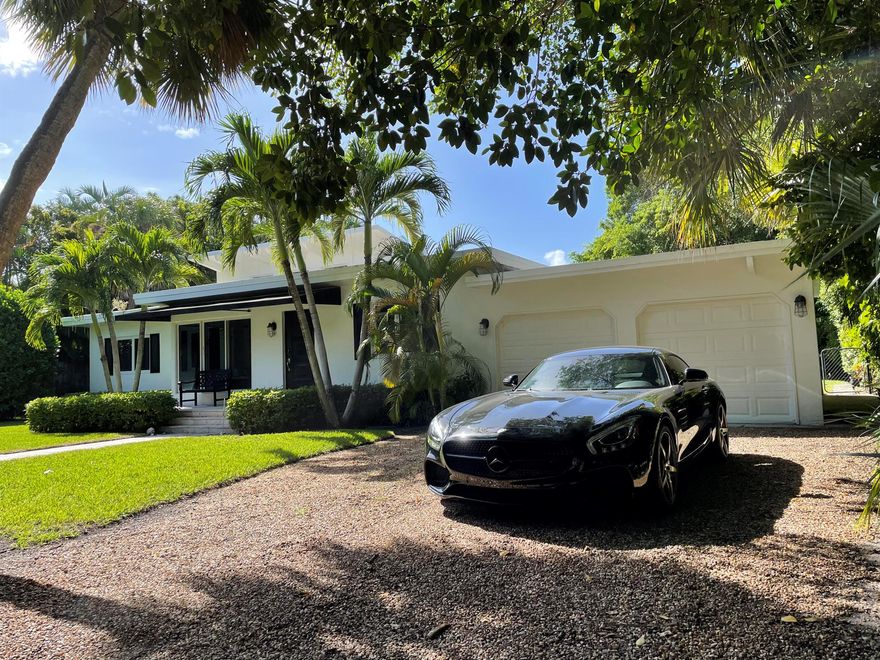 Tucked away upon a rare, lushly landscaped oversized (15,500 sq ft) & private lot on Hypoluxo Island sits this Mid-Century Modern gem. This inviting single-story home features 3 bedrooms, 2 bathrooms, eat-in kitchen and a great room with a pecky cypress beamed ceiling & transom windows which flood the living space with light-filled cheer. Step outside to the vast fenced-in backyard replete with mature palm trees, tropical landscaping, spacious lawn & swimming pool. This island home is the perfect place to create new memories & to spend your sunny, lazy days.