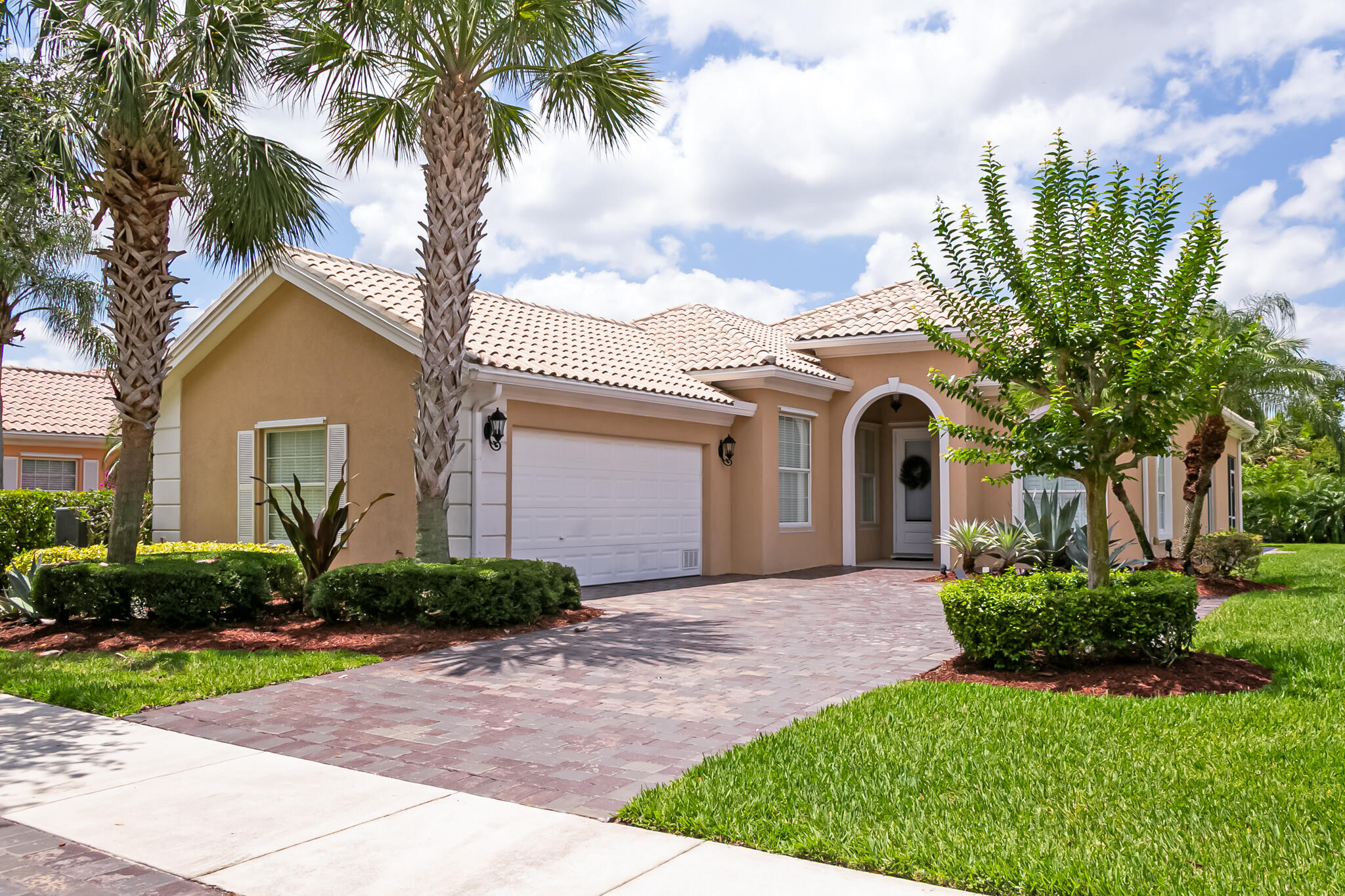 Welcome to this beautifully maintained, furnished DiVosta-built home, offering 3 bedrooms, 2 bathrooms, and a flexible den--perfect for a home office or guest space. The open-concept layout features plantation shutters, crown molding, and a spacious screened-in patio overlooking a serene, private backyard--ideal for relaxing or entertaining. Enjoy tranquil lake views from the front of the home, adding to the peaceful ambiance.Nestled in the heart of The Lakes at Tradition, this home is just a short stroll from shopping, dining, parks, and vibrant community events. Residents enjoy resort-style amenities such as a newly renovated clubhouse, two heated pools, tennis and pickleball courts, bocce ball, a fitness center, 24-hour manned gated security--and the added bonus