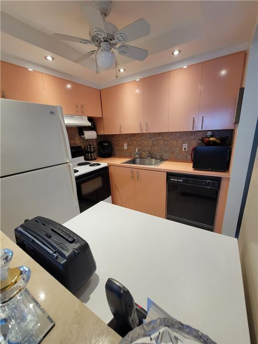 Beautiful first floor unit one bedroom one and a half bath. Must look at this lovely unit, tiled floors thru out up dated kitchen, tub with shower in master bath. This home is completely furnished-ready to move in now.
