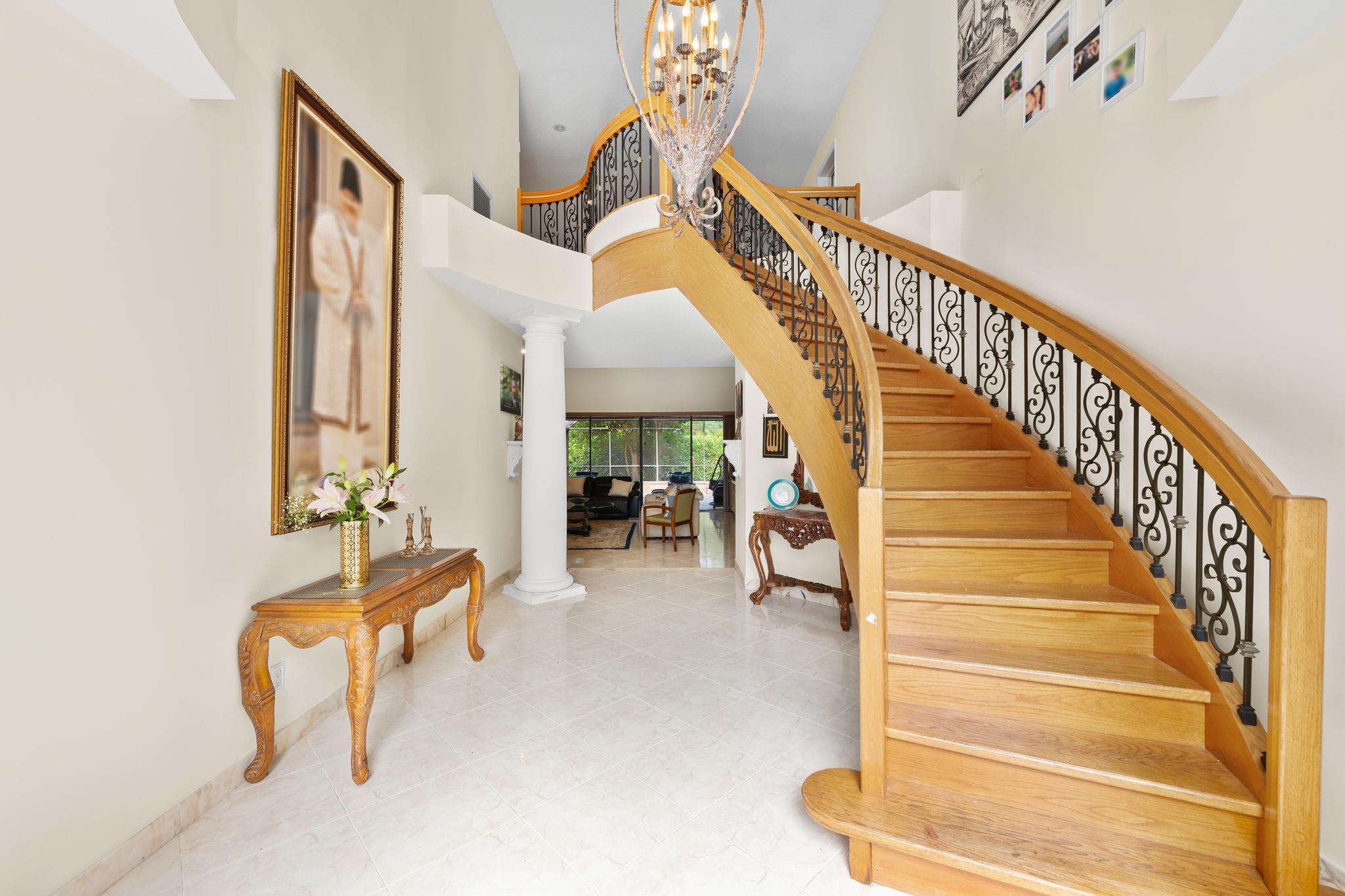 Exceptional 6BR/3-2hb stunning residence nestled on a corner lot in the prestigious, gated community of Eagle Trace. This super energy-efficient home features soaring ceilings, sleek LED lighting, and a thoughtfully designed floorplan ideal for both comfort and style. Chef's Kitchen – Outfitted with premium appliances, a massive granite island, custom cabinetry, it's a dream space for culinary creativity. Enjoy a generous dining area perfect for hosting, with large family room overlooking the screened-in pool. Lavish Primary Suite – Indulge in two custom walk-in closets and a spa-inspired bathroom complete with a floating vanity, soaking tub, and glass-enclosed shower. Enjoy amenities including golf, tennis, and more.