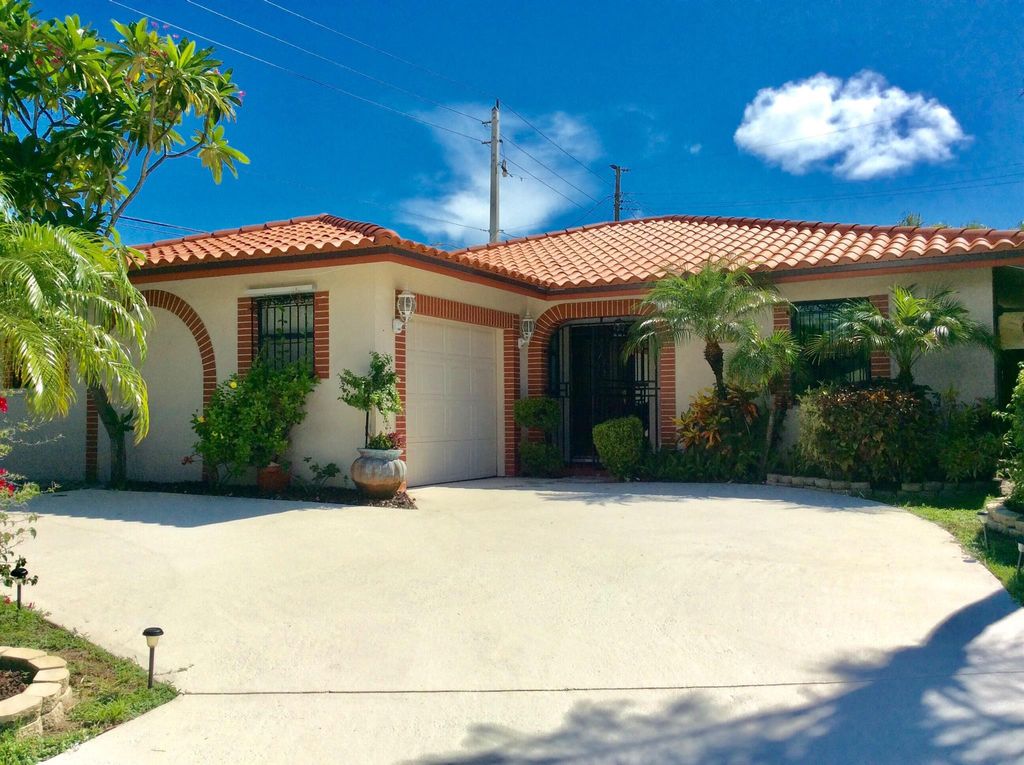 Photo of 1035 Soelca Drive, West Palm Beach, FL 33405 (MLS # R11105741)