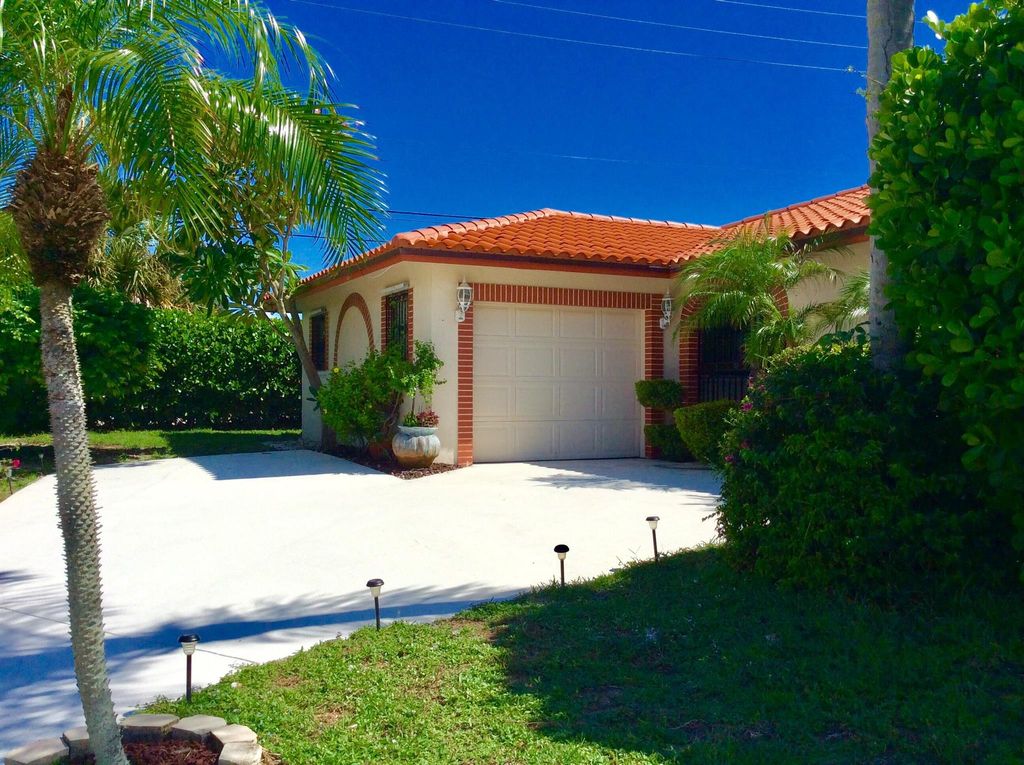 Photo of 1035 Soelca Drive, West Palm Beach, FL 33405 (MLS # R11105741)