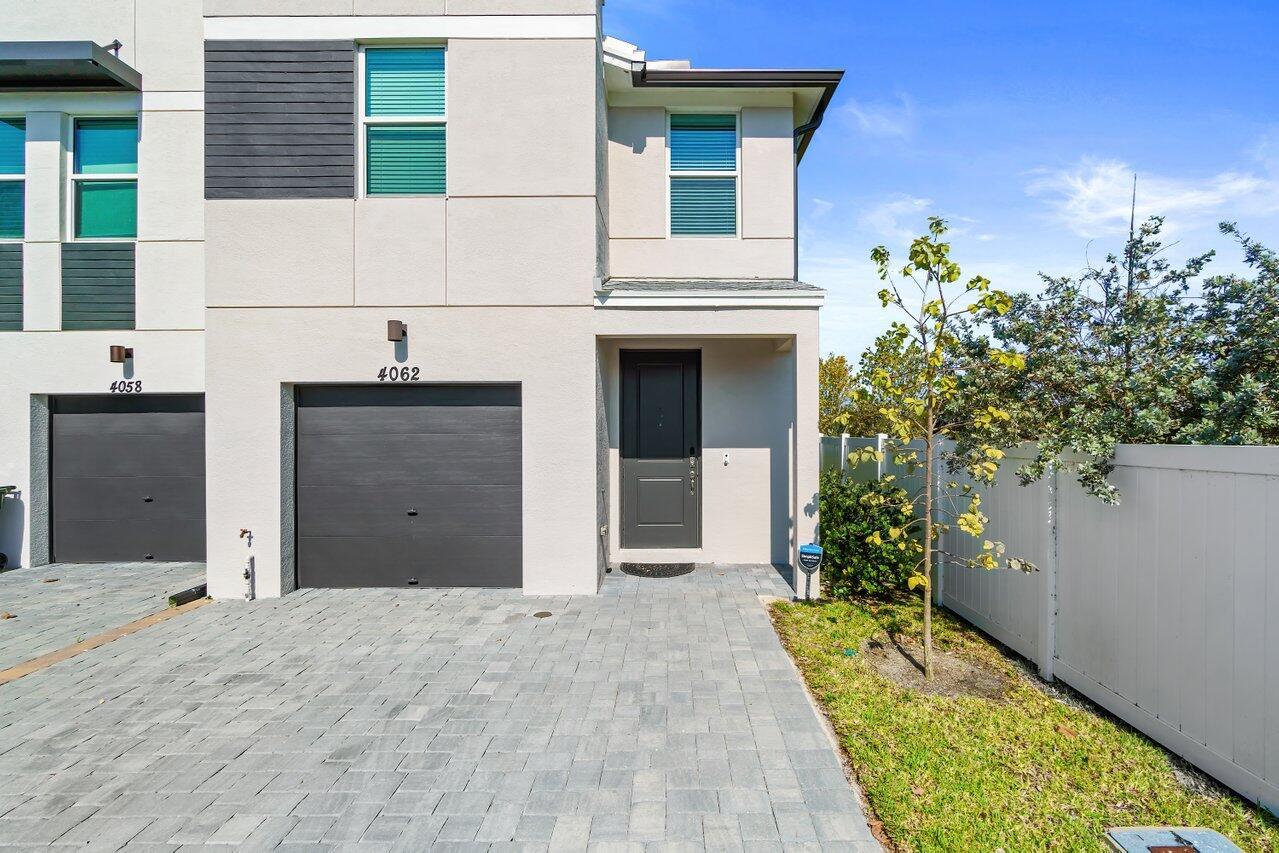 Must see Open Concept, SPACIOUS, End-Unit Townhouse built in 2022. Featuring 3 bedrooms, a loft, 2.5 bathrooms, and a 1-car garage. This home is equipped with modern amenities, including stainless steel kitchen appliances, impact windows and doors, a well-appointed washer and dryer upstairs, and expansive living and dining areas. The master suite is a true retreat with two walk-in closets. Perfectly positioned just 2.5 miles from downtown, 4 miles from the beach, with easy access to I-95 and PB Int'l airport. The community offers amenities like a children's playground and shaded picnic areas. Don't miss the opportunity to make this luxurious townhouse your new home TODAY!