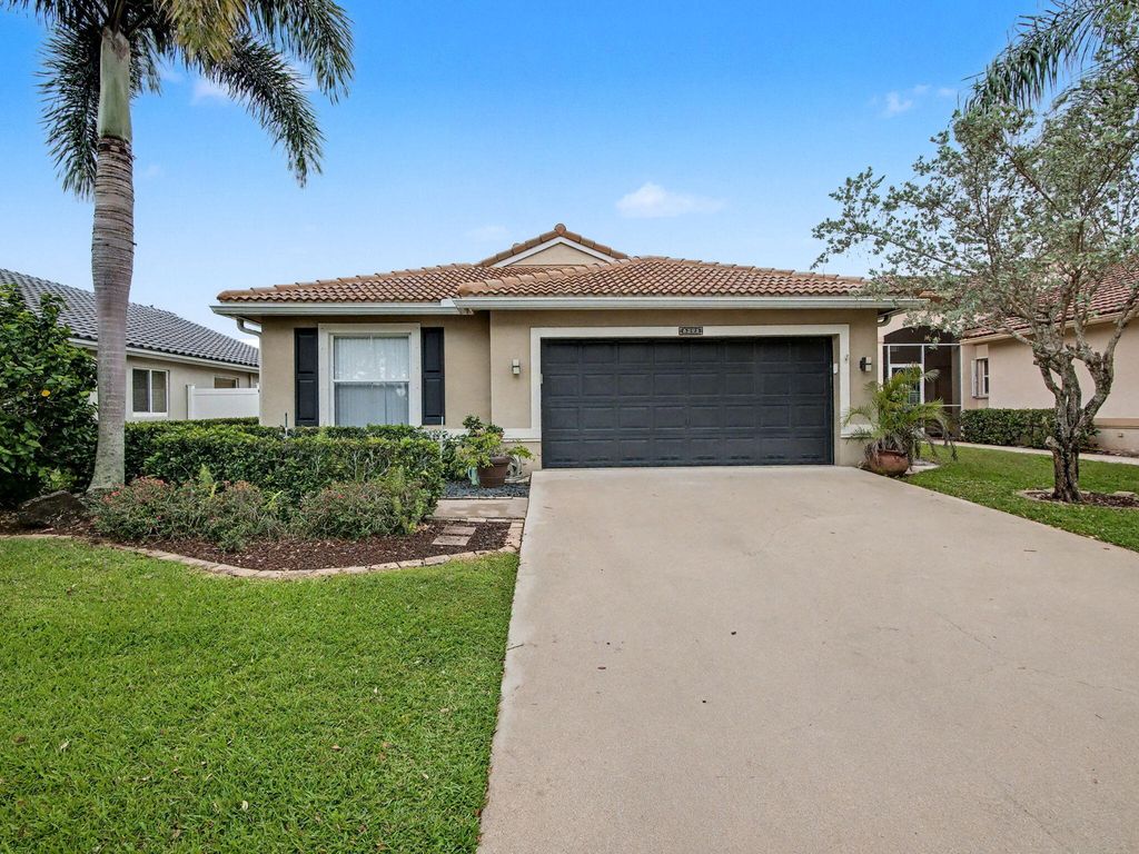 Photo of 6292 Grand Cypress Circle, Lake Worth, FL 33463 (MLS # B26019976)