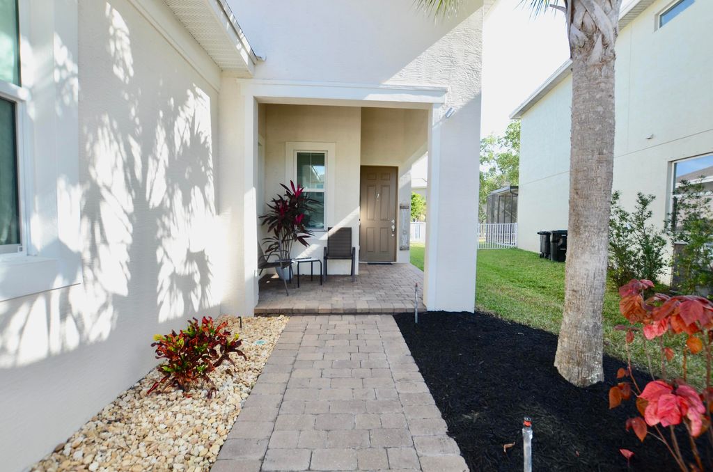Photo of 1897 NW Cataluna Circle, Port Saint Lucie, FL 34986 (MLS # B26042609)