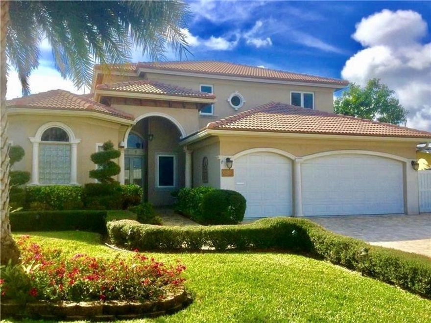 Beautiful 2 story home w 22 ft ceilings. 2 master suites downstairs, 3 bedrooms upstairs (1 used as a study) & loft area. Beautiful marble throughout ground floor and walnut wood on staircase & 2nd floor. Gorgeous open kitchen with family room and dining area open to private pool, spa and garden area. Impact doors and windows.  Built in 2007! One of the most outstanding residences in Laud by the Sea. Perfect location-quick walk to beach & nightlife. Have to see to appreciate!