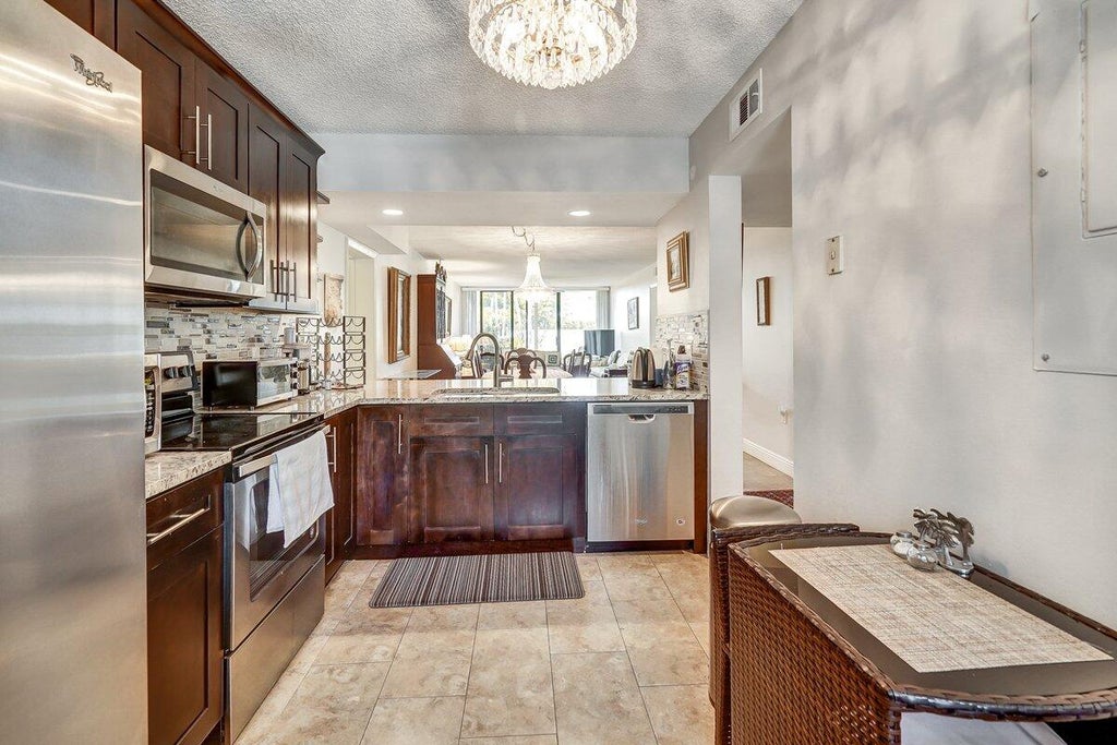 Photo of 2741 Village Boulevard #104, West Palm Beach, FL 33409 (MLS # R10913469)