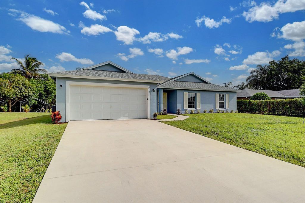 Photo of 517 SW Ray Avenue, Port St Lucie, FL 34983 (MLS # R10914487)