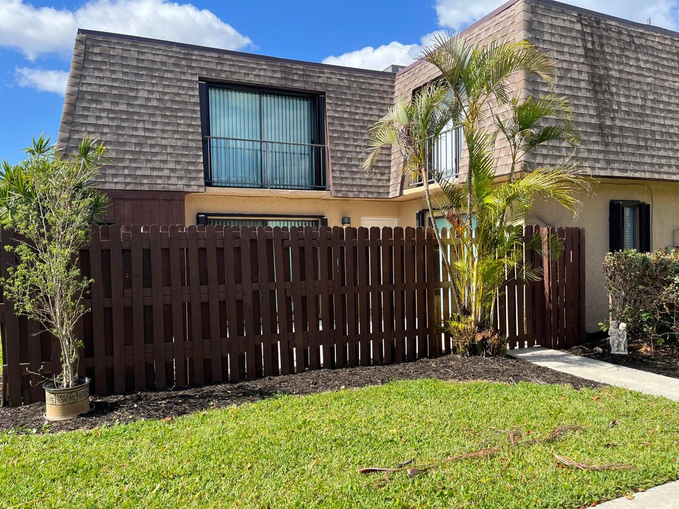 Beautiful updated townhome. Tiled Throughout! Accordion Shutters! Large fenced in patio! Gorgeous Lake Views From Bedrooms!