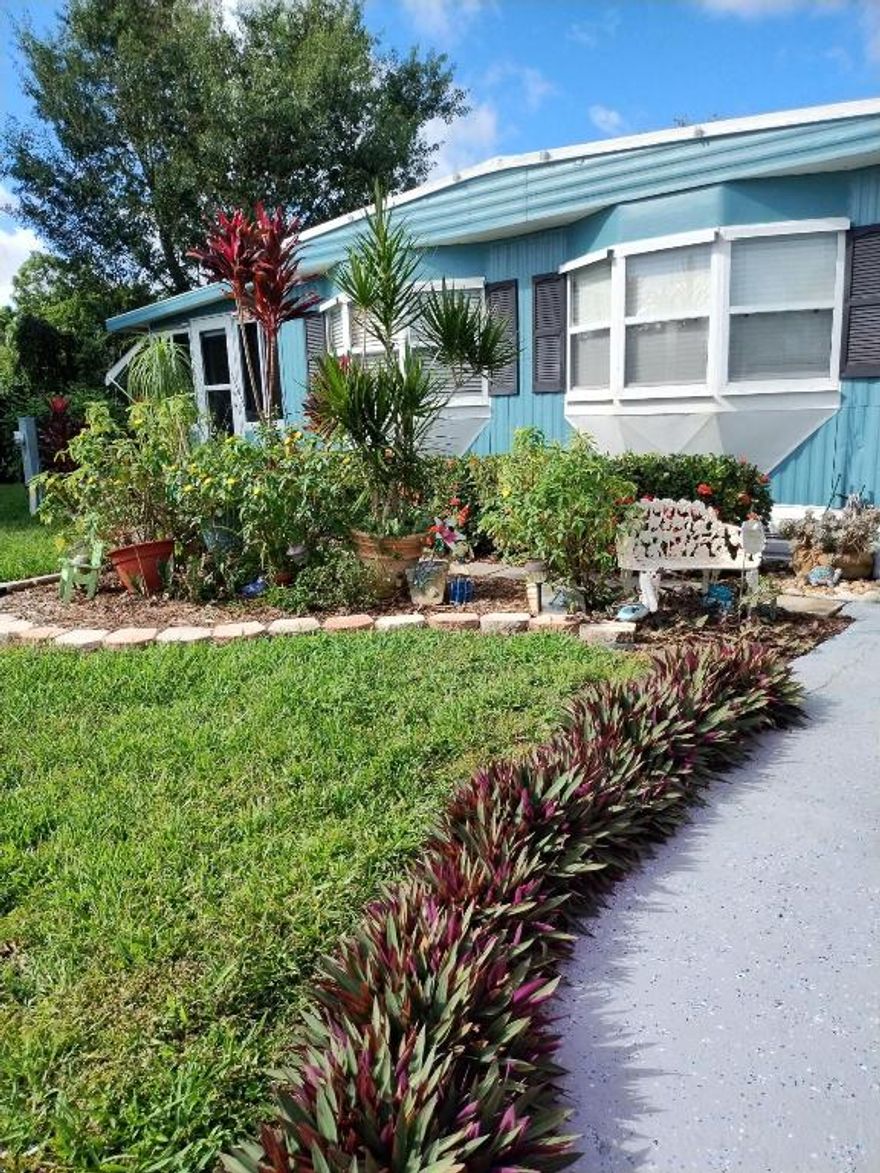 Beautiful home inside and out. This home offers 2 bedrooms, walk in closet in master, 2 baths, spacious living room and Florida room, oversized lot and beautifully landscaped. Exterior painted in 2025, New hot water heater in 2025, roof re coated in 2025,ac on service contract. Handicap accessible with front ramp, full size entry door, pocket door for master, handicap master bath with roll in shower and grab bars, lift in master. Kitchen and master bath updated in 2023.  possession to be 30 days after closing. A real must see, Priced to Sell