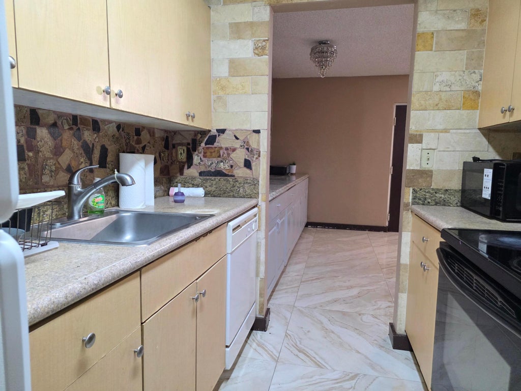 Photo of 1127 LAKE TERRY Drive #C, West Palm Beach, FL 33411 (MLS # B26053362)
