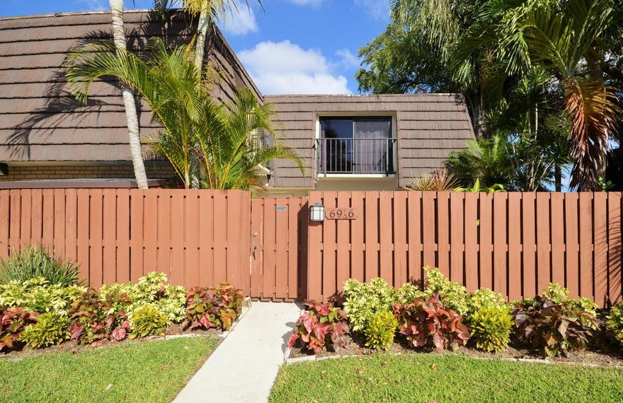 Great location, 2 story townhouse with large fenced patio, 2 parking on front the property. Community has fantastic pool, walking trails, tennis courts, recreation area, biking, close to Village Commons, next to Ball Park, I-95, PB Airport and downtown. Home has tiled floors on first floor and wood on staircase and two bedrooms, new doors, new stainless steel appliances, VU light in A/C unit, great patio with extended shed for extra storage and  outdoor sitting area.