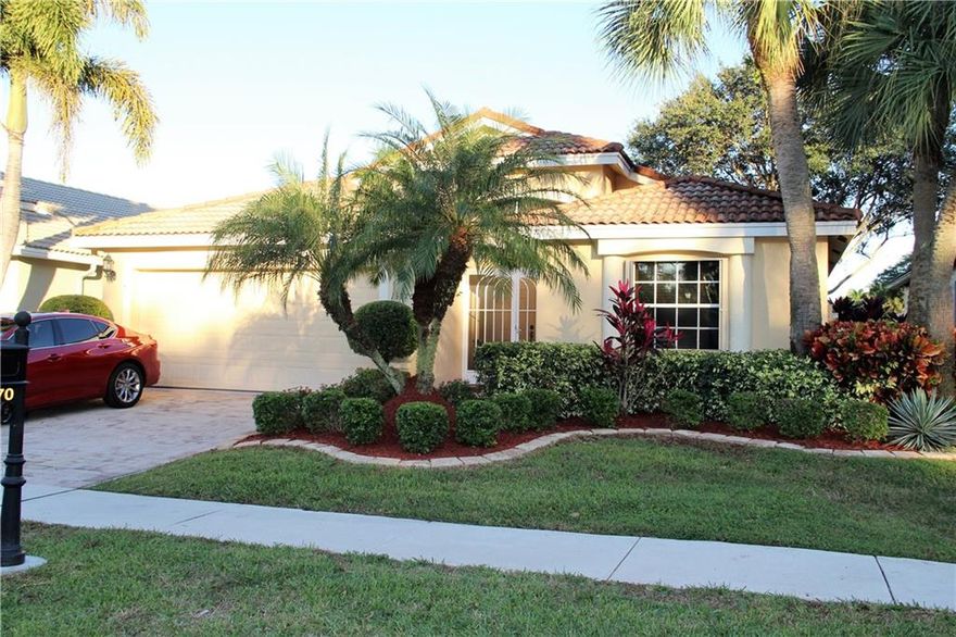 Beautiful water views from the moment you walk thru the door make this a most desirable sought-after home within the amiable and active Community of Villa Borghese. Enjoy the sunshine as it explodes thru the house and creates a warm and friendly atmosphere. White floors and walls and white cabinetry give an opportunity to create your own touch and color scheme. Sit out on your lanai and enjoy the beauty of nature while overlooking the water.